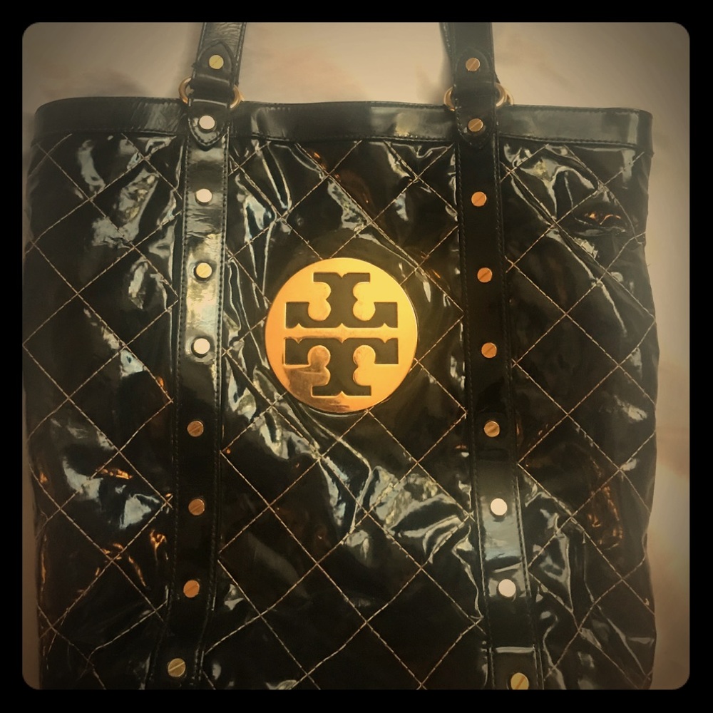 The brand Tory Burch black patent leather purse